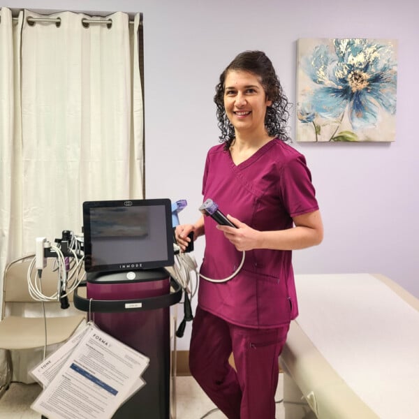 Photo of Dr Campbell with Empower RF machine